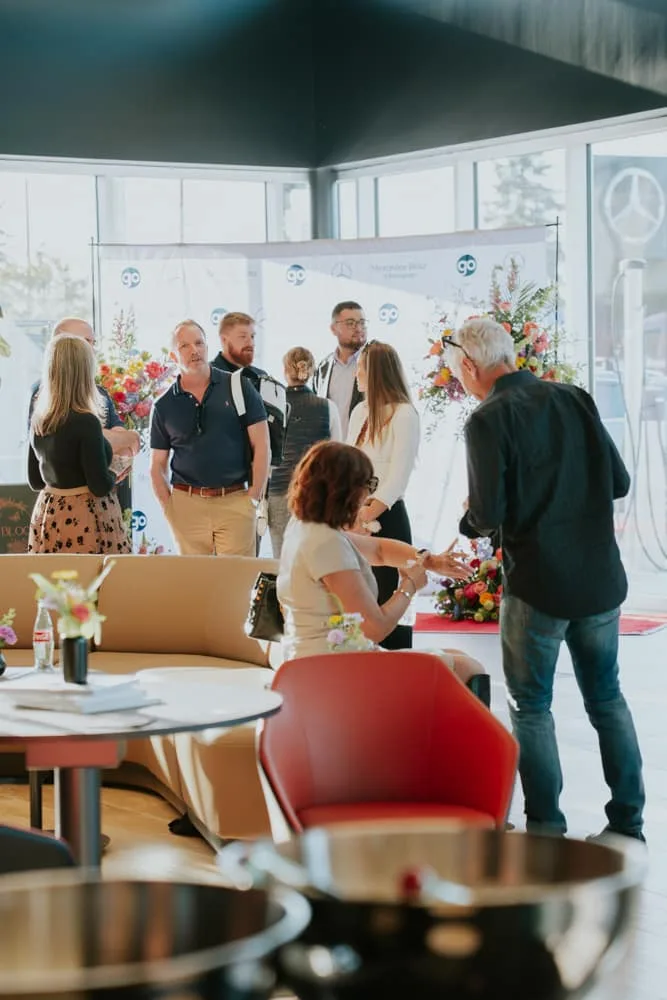 Dealership grand opening event details with vendor coordination and corporate presentation